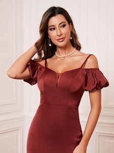 Detail of burgundy satin dress with off-the-shoulder puff sleeves and sheer v-neckline