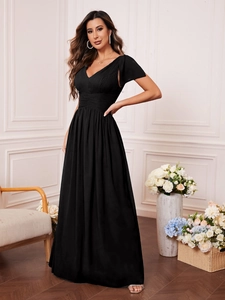 Detail view of black V-neck maxi dress featuring pleated waist and ruffled sleeve design