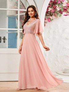 Detail of pink V-neck evening gown with shimmering sequins and flowing chiffon sleeves