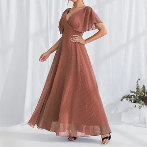 Detail of pink polka dot evening gown with V-neck and elegant ruffled butterfly sleeves