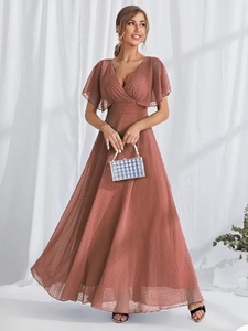 Detail of elegant V-neck pink Swiss dot evening gown with tiered ruffle flutter sleeves