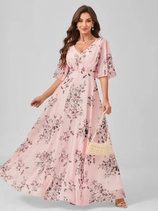 Close-up of V-neck floral dress with flutter sleeves and elegant pearl accessories