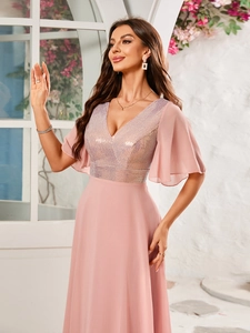Detail of sequined V-neck bodice and light flutter sleeves on a pink evening gown