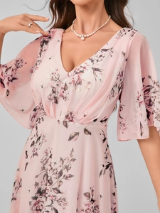 Detail of V-neckline and flutter sleeves on a light pink floral chiffon evening dress