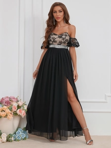 Detailed close-up of sequined waist belt and elegant lace embroidery on evening dress