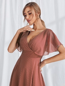 Detail view of pink V-neck Swiss dot dress with ruffled cap sleeves for banquet style