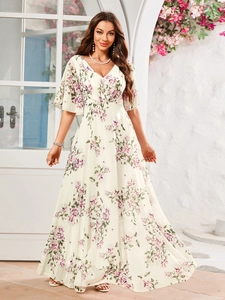Detail of V-neck floral maxi dress featuring ruffles and elegant purple print on cream fabric