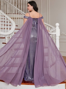Detail of elegant purple sequin evening gown with long flowing chiffon cape from the back