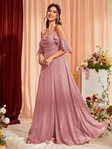 Detailed view of dusty rose evening dress with ruffled sleeves and pleated bodice