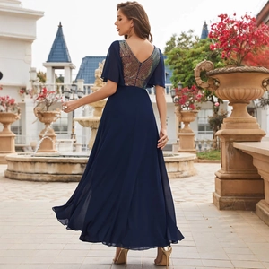 Elegant navy blue V-neck evening gown with sequin details and flowing chiffon skirt