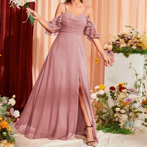 Detail of elegant dusty mauve chiffon evening dress with spaghetti straps and high slit