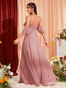 Detail of dusty pink bridesmaid dress with ruffled sleeves and thin straps back view