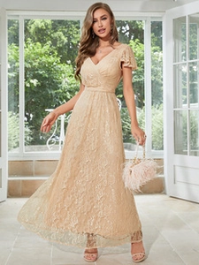 Detail of elegant champagne lace evening gown with V-neckline and slim waist design