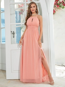 Detail view of pink chiffon evening dress featuring keyhole halter neck and high leg slit