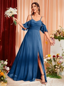 Detail of navy blue off-shoulder evening dress with ruffled sleeves and high slit