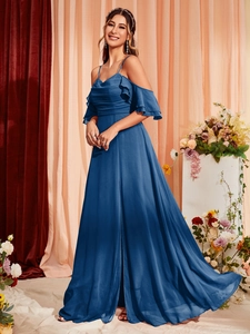 Detail view showing high-slit navy blue chiffon evening gown with elegant ruffles