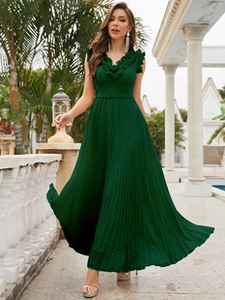 Macro shot of elegant dark green pleated sleeveless evening gown with ruffled neckline detail