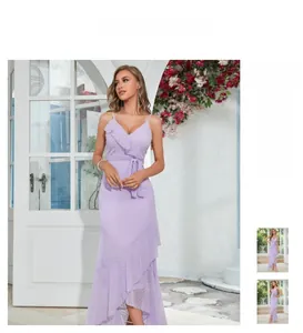 Detail of purple sleeveless V-neck dress featuring polka dot texture and ruffled hem