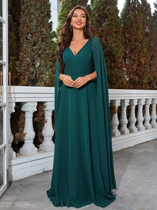 Detail of elegant dark green evening gown featuring V-neckline and pleated chiffon fabric