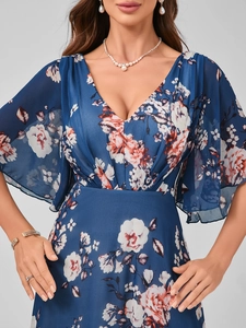 Detailed view of the elegant V-neckline and flutter sleeves on the floral maxi dress