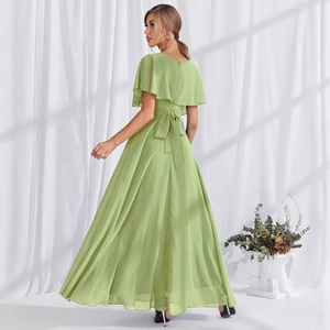 Light green Swiss dot evening maxi dress with ruffle sleeves and back bow tie detail