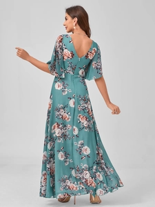 Detail view of the deep V-neck backless floral dress with elegant ruffled sleeves