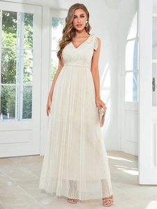 Detail of elegant V-neck lace bodice and delicate layered tulle skirt in ivory white