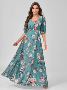 Detailed close-up of V-neck floral evening dress featuring elegant white rose patterns