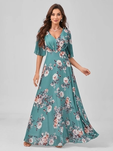 Close-up of elegant V-neck floral chiffon dress with detailed green and pink print pattern