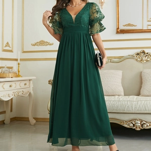 Detail of dark green evening gown featuring sheer lace flutter sleeves and V-neckline