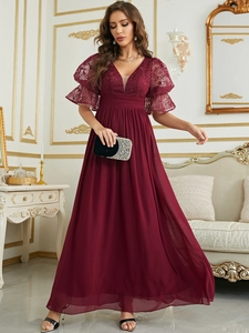Detailed close-up of wine red lace V-neck bodice and puff sleeves on evening dress