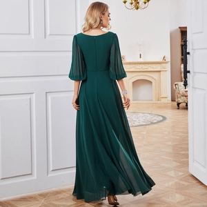 Elegant dark green chiffon evening gown with lantern sleeves and a slimming long dress cut