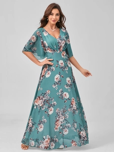 Detail of teal floral chiffon maxi dress with deep V-neck and ruffled sleeves for summer