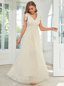 Close-up of elegant ivory lace V-neck bodice with delicate ribbon shoulder ties