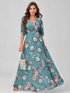 Detail of V-neck floral print evening dress with flutter sleeves and flowing maxi skirt