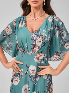 Detail of elegant V-neck floral maxi dress featuring flowy ruffle sleeves and teal chiffon