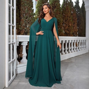 Elegant emerald green V-neck evening gown featuring unique floor-length cape sleeves