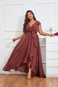 Detail of elegant rust red chiffon dress with deep V-neck and ruffled shoulder accents