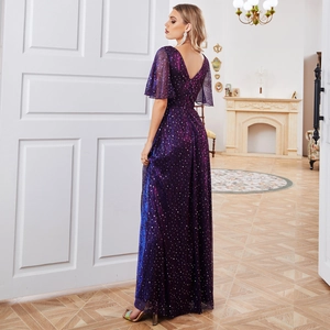Detail of elegant purple V-neck evening gown with shimmering silver sequins and ruffle sleeves