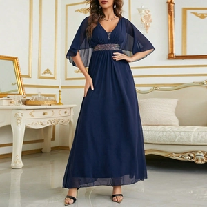 Detail of navy blue V-neck chiffon dress showing flutter sleeves and sequin waistband