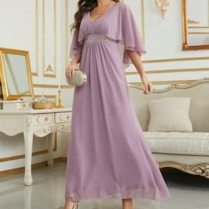 Detailed view of lavender V-neck dress featuring a shimmering sequined waistband and cape sleeves