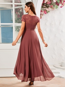 Detail of the back view showing delicate lace stitching and airy chiffon fabric on a gown