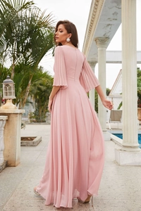 Detail of pink chiffon evening gown featuring pleated bell sleeves and elegant draping