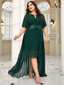 Detail of sequin floral lace on dark green chiffon dress with high-low hem and ruffled sleeves