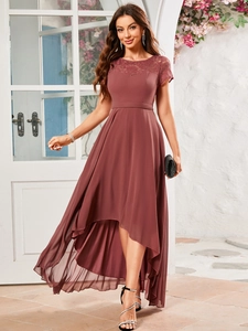 Detailed view of the high-low hemline and elegant lace bodice on the mauve evening dress