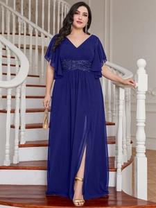 Detail of navy blue V-neck dress featuring sequined waist and ruffled sleeves with high slit