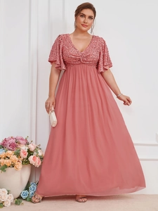 Close-up of pink sequined bodice and V-neck chiffon evening dress with ruffled sleeves