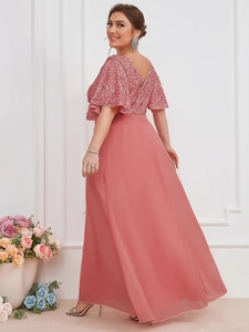 Detail of pink sequin bodice and flowing chiffon maxi skirt on an elegant evening gown