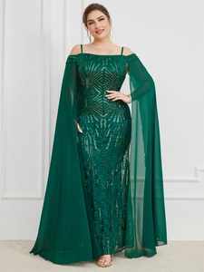 Detail of dark green sequin evening gown featuring cape sleeves and geometric embroidery