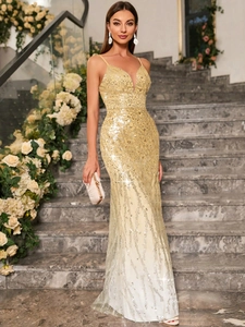 Detail of elegant V-neck champagne gold sequined evening gown with mermaid silhouette